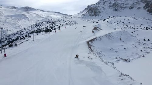 A snow covered mountain with a ski slope