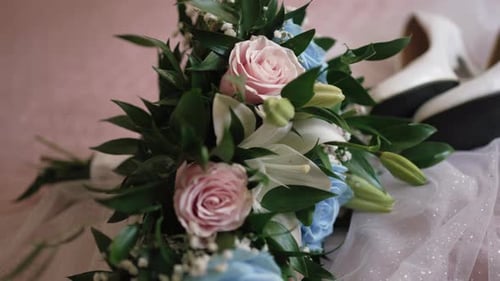 Wedding bouquet with roses and lilies close up