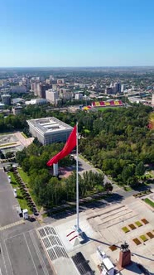 Aerial view of Kyrgyzstan Parliament, Flagpole, and Panfilov Park in Bishkek