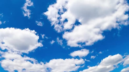 Quick transformation of white clouds in the atmosphere. Fluffy cloudscape growing in the sky