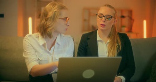 Close Up Of Two Women Talking During Business Meeting