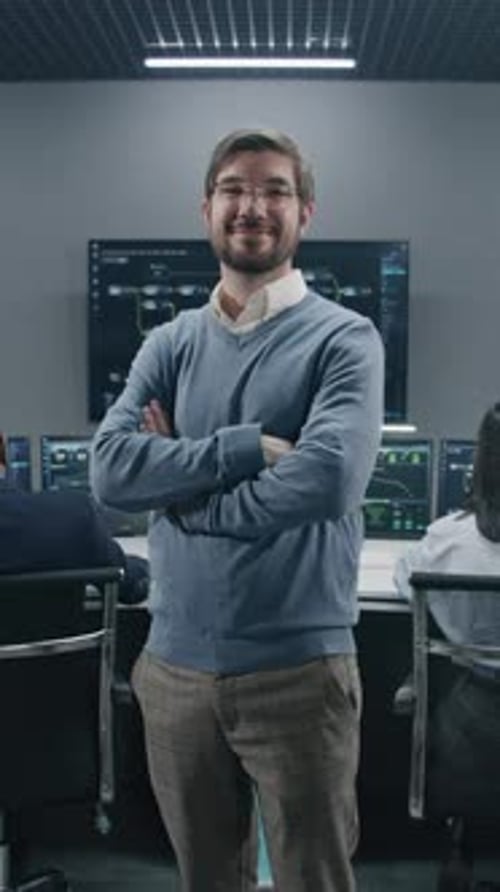 Man Smiling in Modern Office Environment