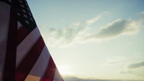 American Flag Waving in the Wind at Sunset