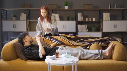 Caring Woman Gives Sick Man Medicine at Home