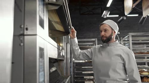 Baker Opens Oven and Presses Control Panel