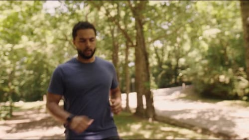 Man Runs on Path and Checks Watch