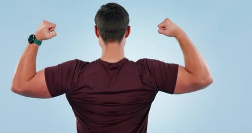 Young Man Flexing Arm Muscles, Isolated