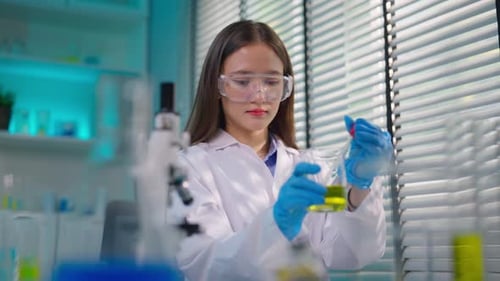 Asian female scientist working in biotechnology research laboratory.