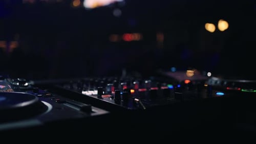 Crowd Of Young People Dancing In Rave Party In Nightclub Closeup View Of DJ Controller