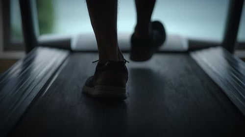 Legs Walking on Treadmill for Fitness Exercise