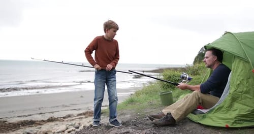 Father teaching Son how to fish