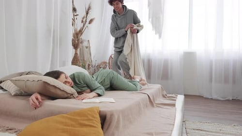 Man Covers Sleeping Girlfriend With Blanket