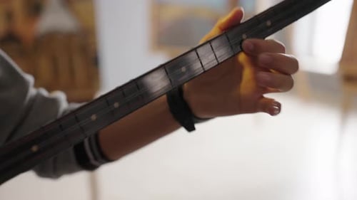 Hands Playing Traditional Turkish Saz (Baglama) – Two Baglamas Side by Side