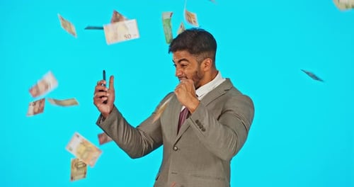 Money rain, winning man and phone isolated on studio background bonus, profit or online trading