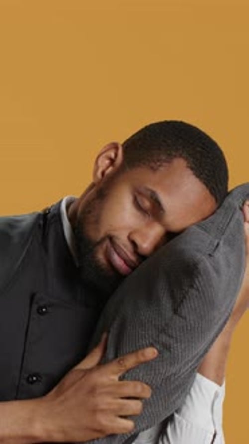 Vertical Video Professional Fatigued Waiter Takes a Nap on His Pillow After Night Shift