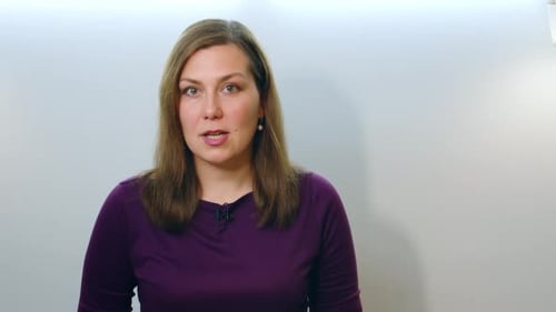 Woman Talking in a Simple Room