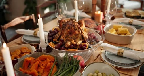 Thanksgiving, gathering and dinner with turkey in dining room for festive holiday