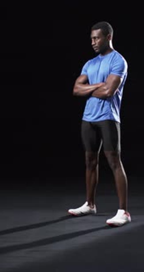 Man Standing with Arms Crossed Wearing Athletic Apparel