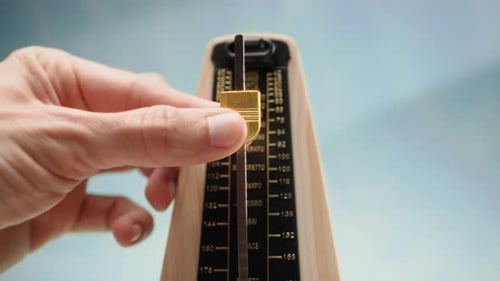 Adjusting the Metronome Pendulum for New Rhythm
