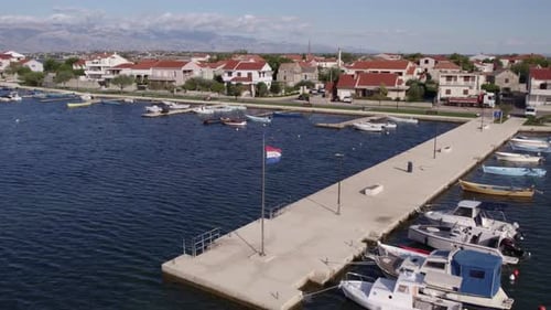 Aerial view of harbour town with boats and houses, Croatia.