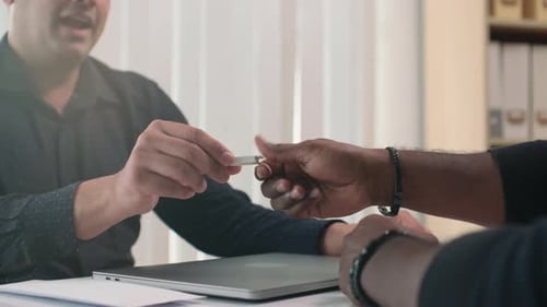 Business Transaction in Bright Office Setting