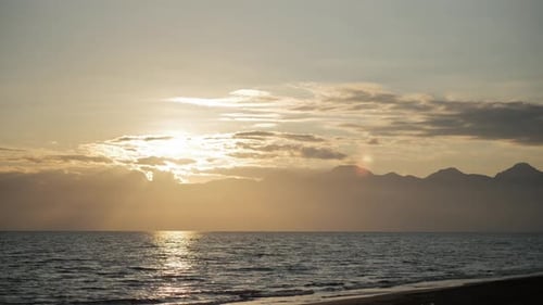 Sunset at Sea with a Small Fishing Boat