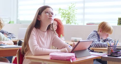 Students Working on Tablets in a Classroom