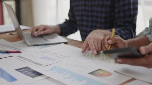 Close up of hands are working and brainstorming on paperwork about business financial and marketing.