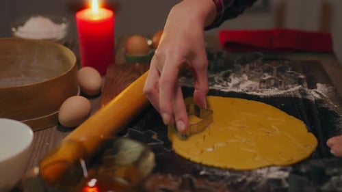 Person Making Star Shaped Festive Cookies at Home