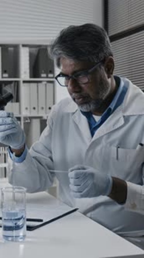 Scientist Performing Experiment in Lab Close Up