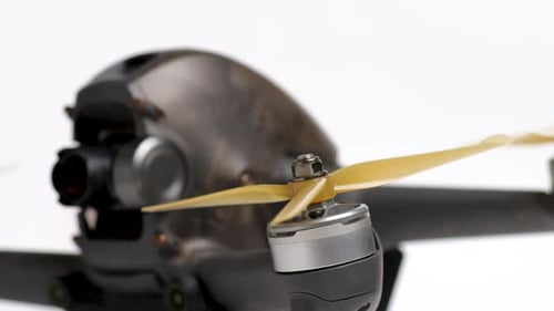 Racing Drone Motor And Propeller Closeup. DJI FPV racing quadcopter details on a white background.