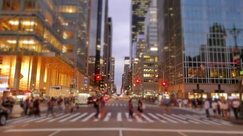 A Bustling City Street Inhabited By Tall Skyscrapers Beneath the Enchanting Dusk Sky