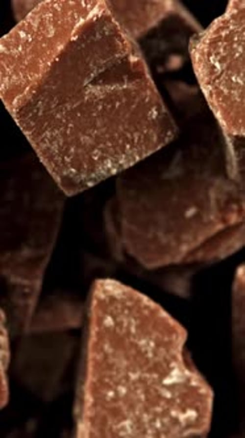 Super Slow Motion Pieces of Dark Milk Chocolate Filmed on a Highspeed Camera at 1000 Fps