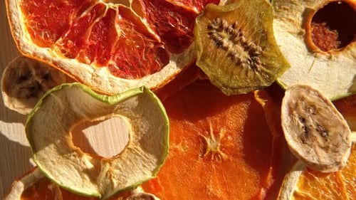 Dried Fruits Assorted of Healthy Sundried Organic Fruit Spinning on Wooden Background Snacking and
