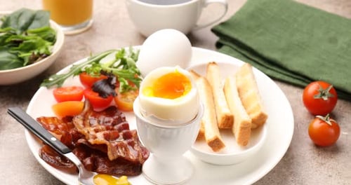 Breakfast Still Life with Egg, Toast, and Bacon
