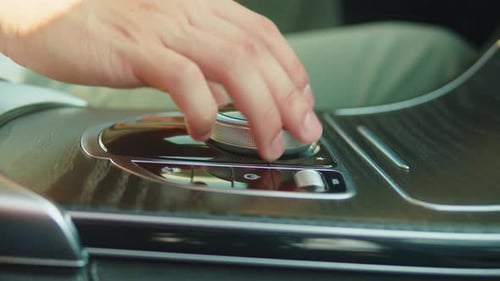 Man in Luxury Car Details of Start Stop Transmission and Choosing Climate Control in the Electric