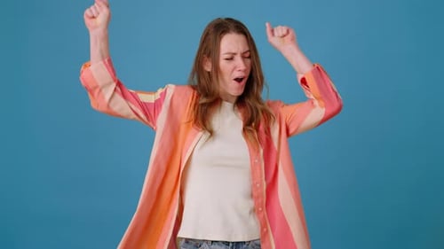 Smiling Female Actively Dances Rejoicing at Achievements