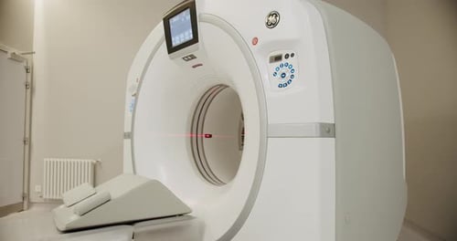 Magnetic Resonance Imaging machine. Hospital room with tomograph.