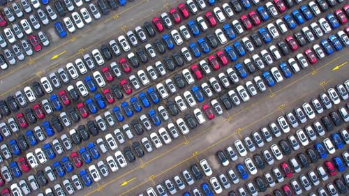 Drones flying over of many vehicles at parking lots