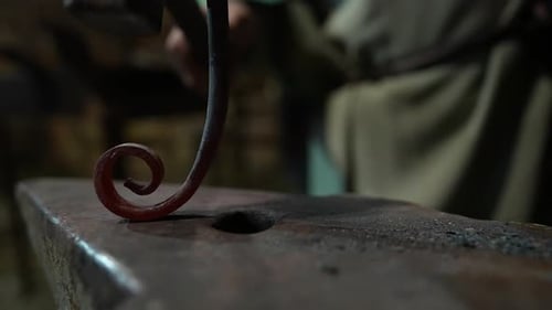 Hammer Strikes Hot Iron, Shaping Tools for Craft Production in Traditional Blacksmith Workshop