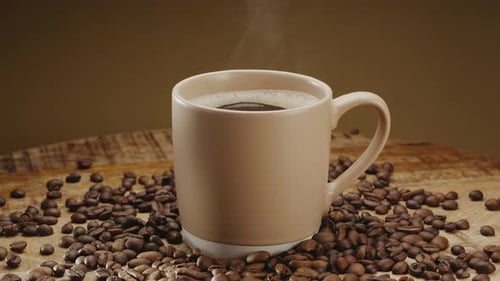 Steaming Coffee Surrounded by Coffee Beans