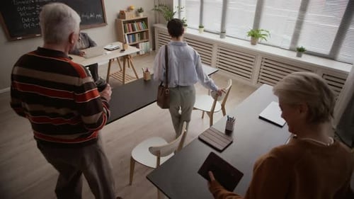 Diverse University Classroom with Female Teacher and Senior Students