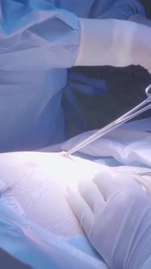 Surgeon Performing Surgery in Hospital Operating Room