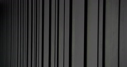 Black Wood Wall of Different Sizes It Moves Slowly Filmed From Perspective