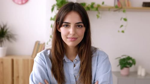 Confident Portrait of Young Businesswoman Looking at Camera in the Office