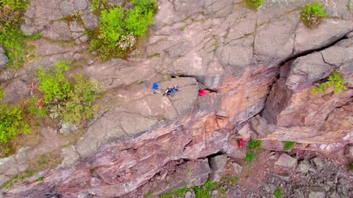 Rock Climbers Climb Down Rocky Cliff, Aerial Drone