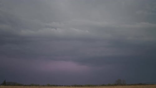 Lightning Strikes Across a Flat Stormy Landscape