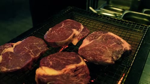 Raw Beef Steak is Being Roasted on the Grill Pan