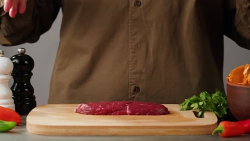 Man Chef Cooking Beef Steak Angus Closeup Professional Cheif Preparing Meat in Restaurant Kitchen