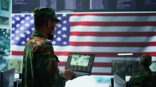 US Soldiers Operating in a High Tech Cybersecurity Command Post